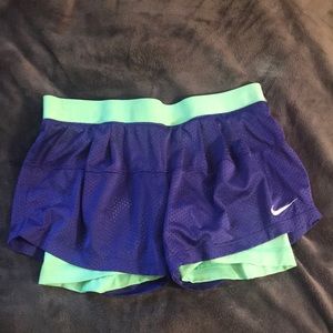 Blue and green Nike athletic shorts